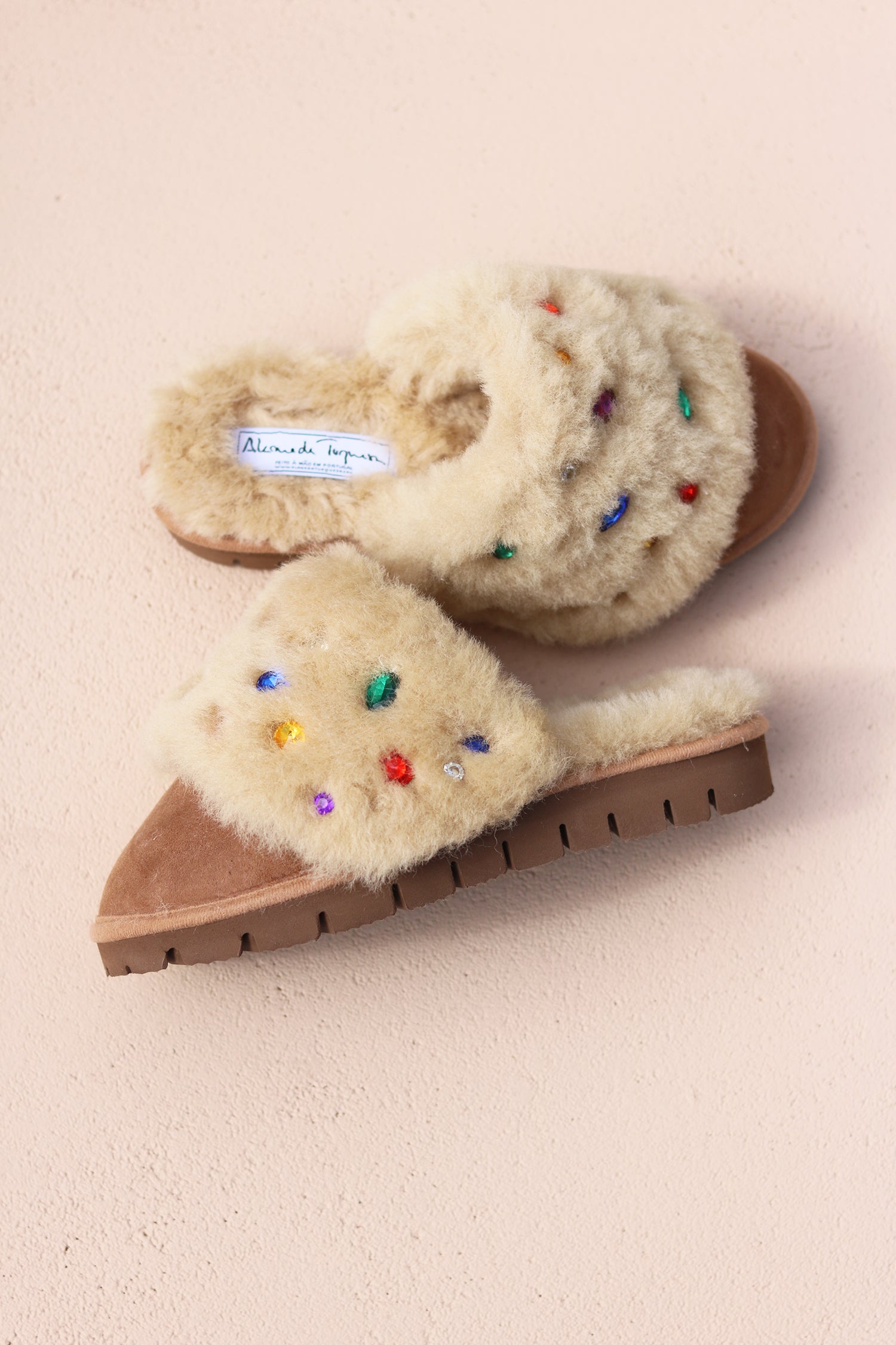 Jasmine flat shearling mule flat lay — cream shearling with multicoloured gemstone embellishments and Alameda Turquesa label, made in Portugal by Alameda Turquesa 