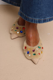 Jasmine shearling heel mule being worn -cream shearling with multicoloured gemstone embellishments, made in Portugal by Alameda Turquesa