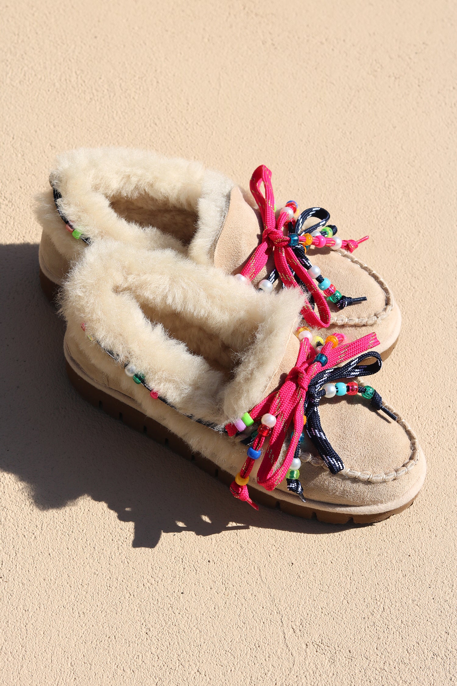 Alameda Turquesa Lou women's shearling moccasins, handmade in Portugal from 100% genuine shearling with colourful beaded pink and navy laces.