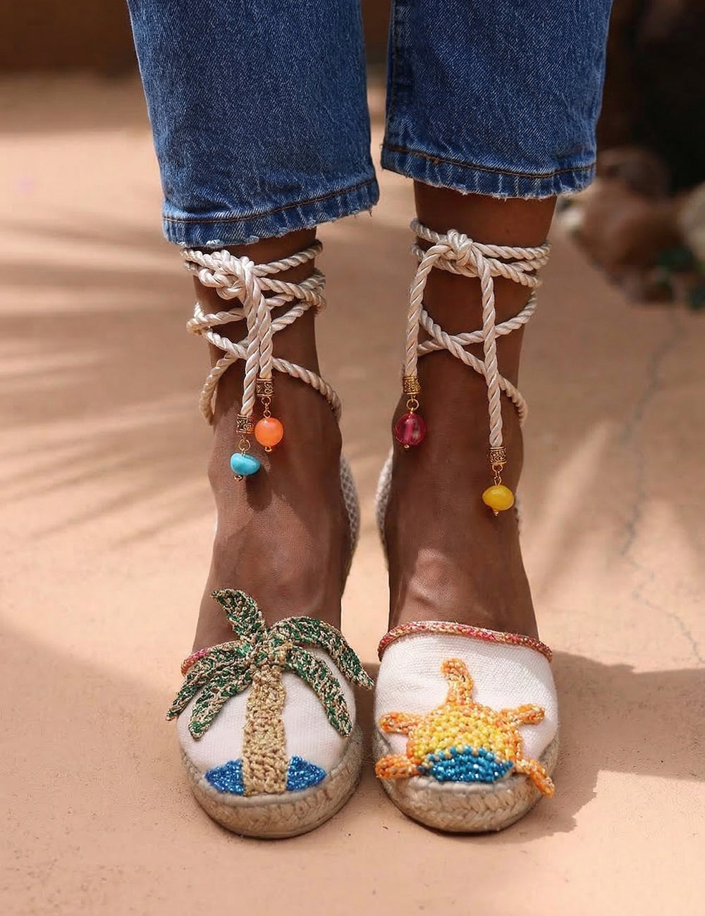 Sunrise wedge espadrilles — hand-embroidered palm tree and sun motifs with silk rope ankle ties and multicolour beaded charms, handcrafted in Portugal by Alameda Turquesa