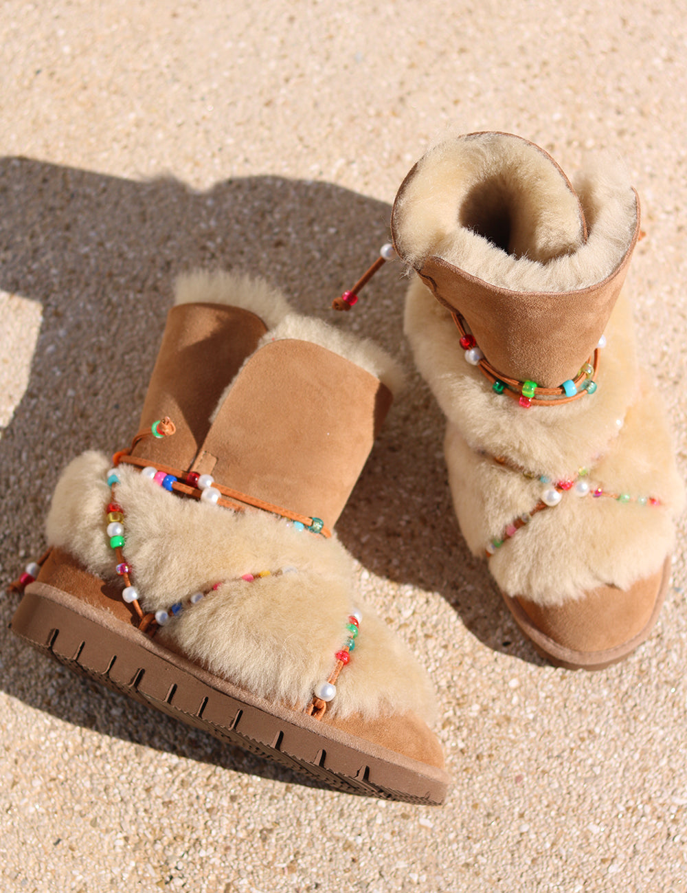 Leo Rainbow Beads shearling boot flat lay, top view — caramel suede and shearling snow boot with multicoloured beaded laces, handmade in Portugal by Alameda Turquesa