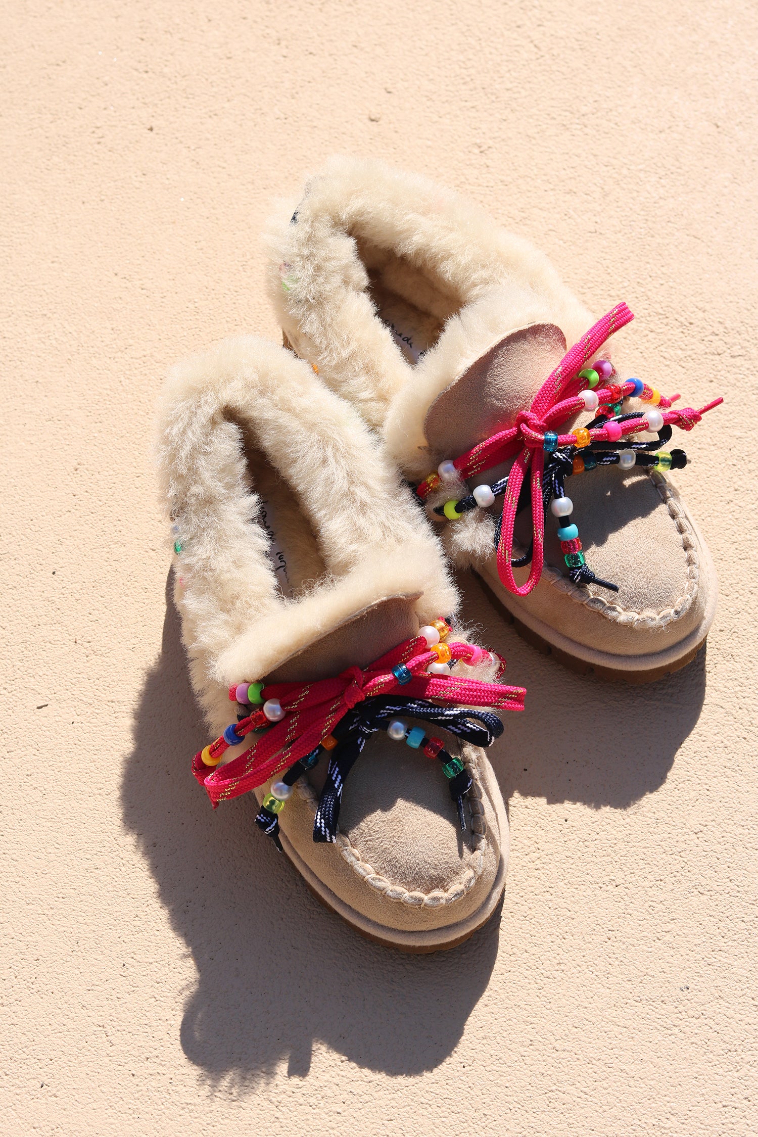 Alameda Turquesa Lou women's shearling moccasins, handmade in Portugal from 100% genuine shearling with colourful beaded pink and navy laces.