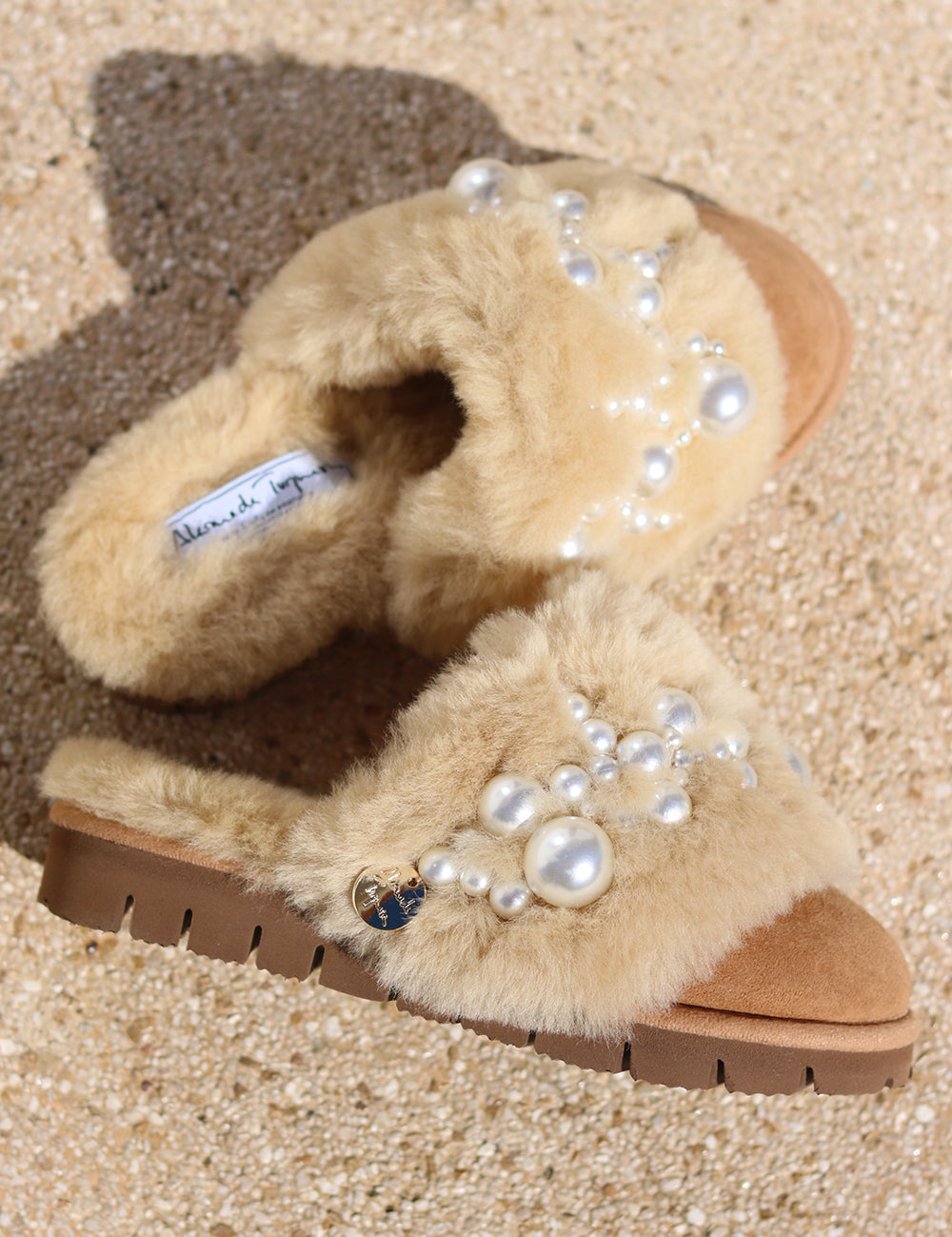 Pinctada Classic Pearls shearling mules close up — hand-applied pearl embellishment detail on caramel shearling, iconic luxury slippers by Alameda Turquesa Portugal