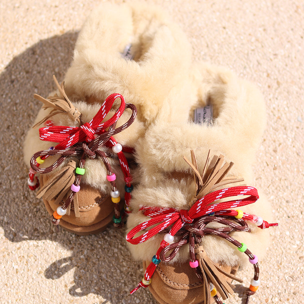 Lola shearling loafers flat lay — handcrafted caramel suede loafers with multicolour beaded laces and leather tassels, Alameda Turquesa Portugal