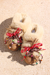 Lola shearling loafers flat lay — handcrafted caramel suede loafers with multicolour beaded laces and leather tassels, Alameda Turquesa Portugal