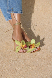 Prudence Gold flower heels side view — handcrafted orchid toe embellishment on slender gold stiletto with lace-up ankle ties, Alameda Turquesa Portugal