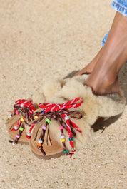 Lola shearling loafer being worn — easy slip-on silhouette with multicolour beaded laces and leather tassels, handcrafted in Portugal by Alameda Turquesa
