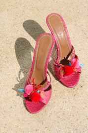 Flamingo mules flat lay — pink woven raffia stiletto heels with handcrafted pom pom and coral embellishments, Alameda Turquesa Portugal