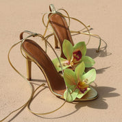 Prudence Gold flower heels detail — handcrafted lime green orchid embellishment and gold stiletto heel, luxury sandals by Alameda Turquesa Portugal