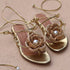 Meredith Crochet Flower Sandals – Gold flat sandals featuring elegant flower embellishments, handcrafted for comfort and style.