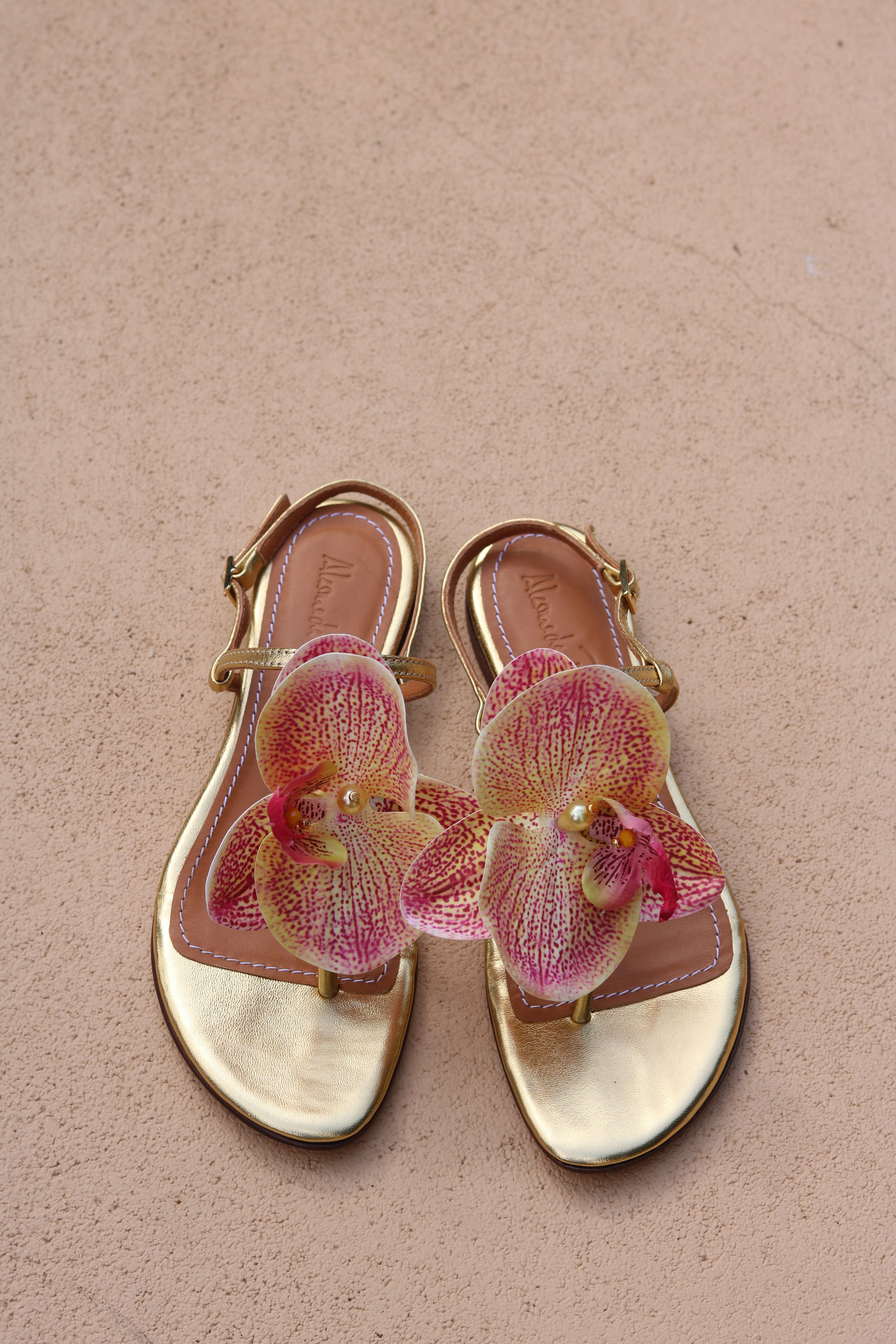 Constance Flower Sandals – Gold flat sandals featuring elegant flower embellishments, handcrafted for comfort and style.