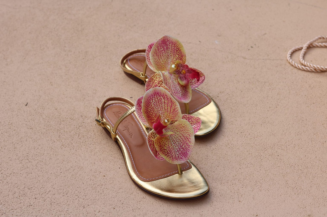 Constance Flower Sandals – Gold flat sandals featuring elegant flower embellishments, handcrafted for comfort and style.