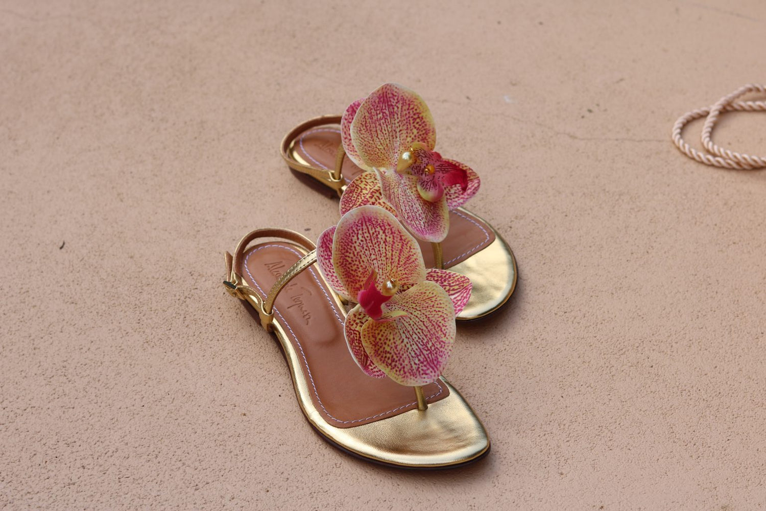 Constance Flower Sandals – Gold flat sandals featuring elegant flower embellishments, handcrafted for comfort and style.